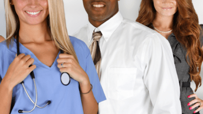 Nurse standing with a man and woman discussing medical issues