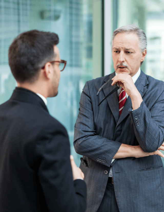Two men discussing the constructive dismissal of an employee.