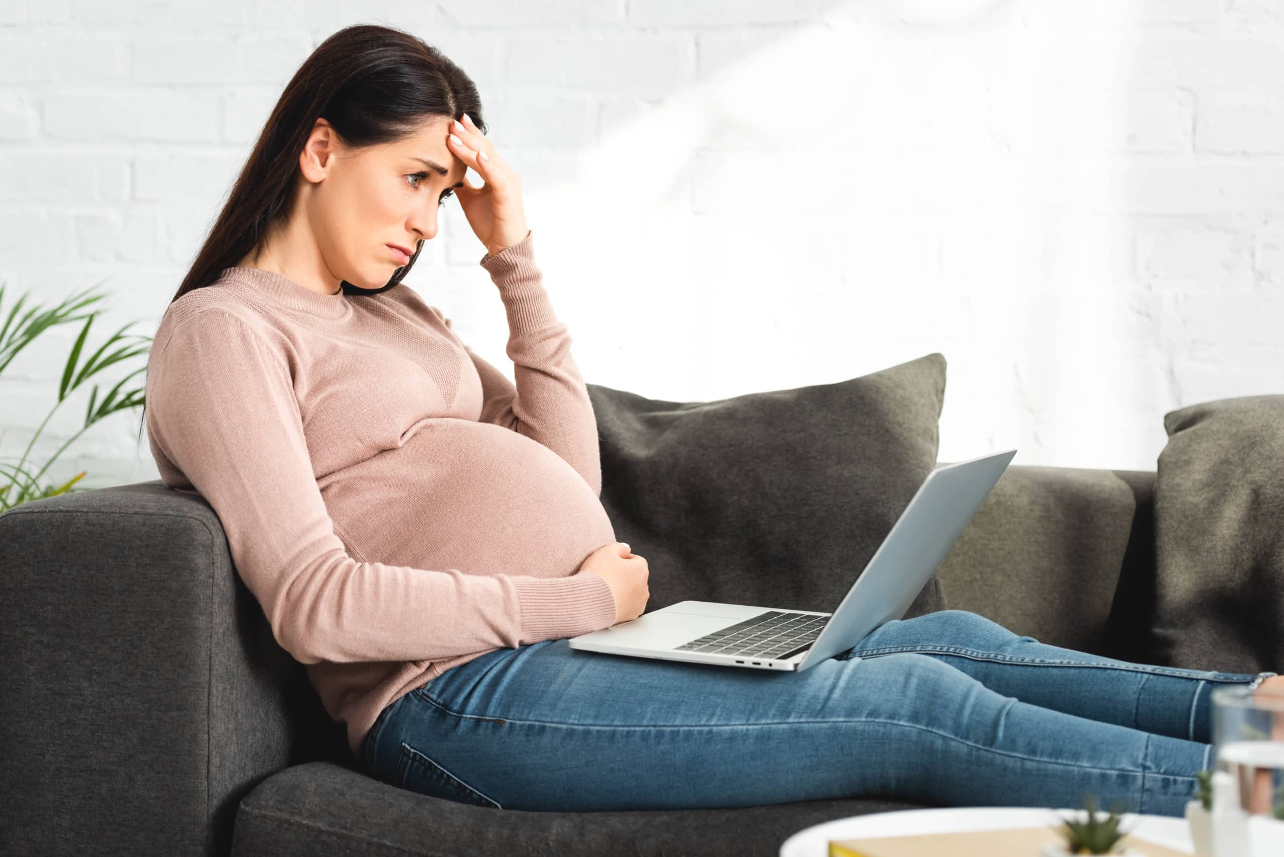 Pregnant woman under stress from employer.