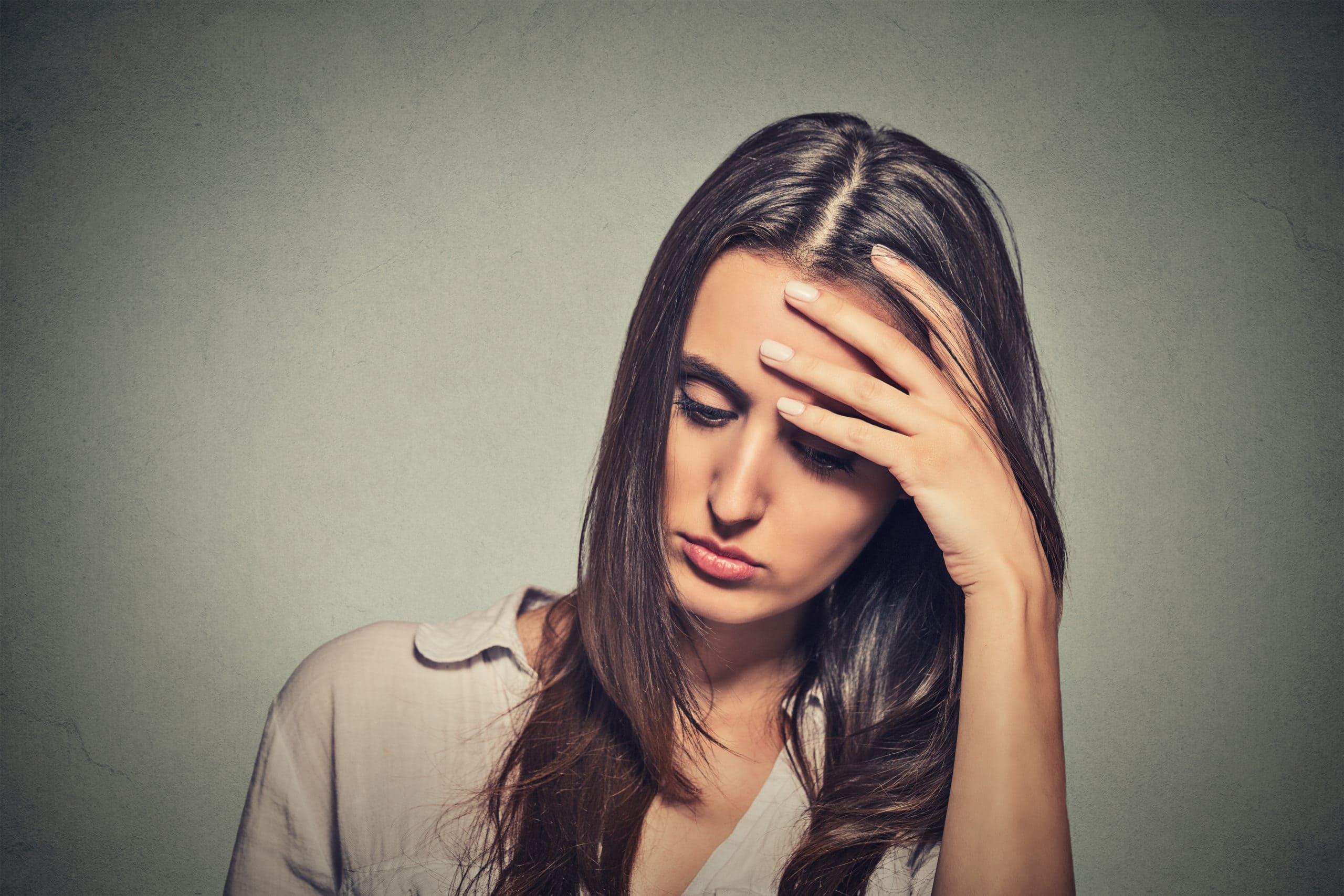 A woman who is stressed out because of covid-19 lay-offs and dismissals