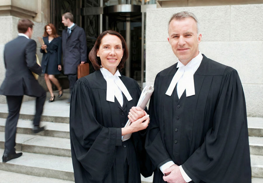 male female lawyers in gowns outside alberta courtroom