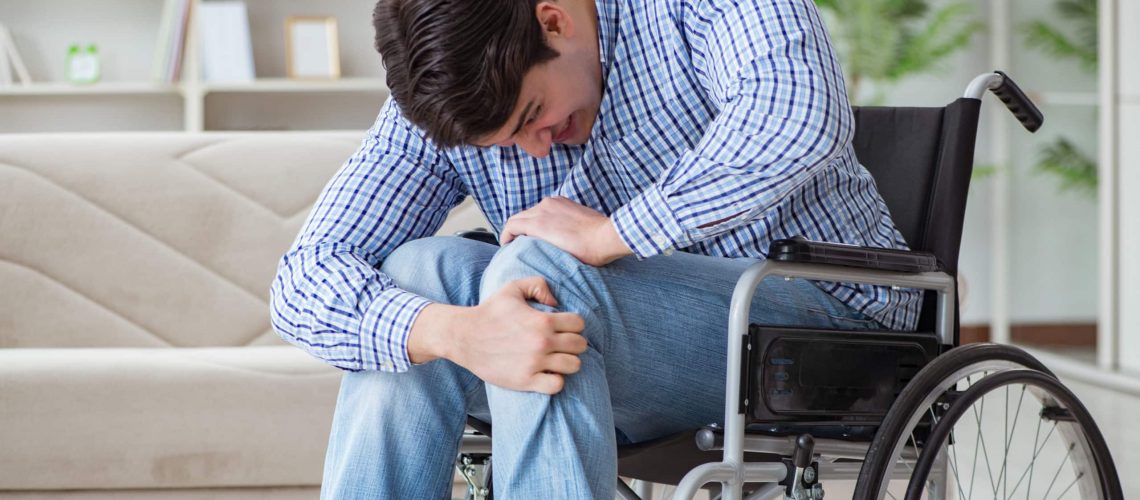 Disabled young man suffering at home