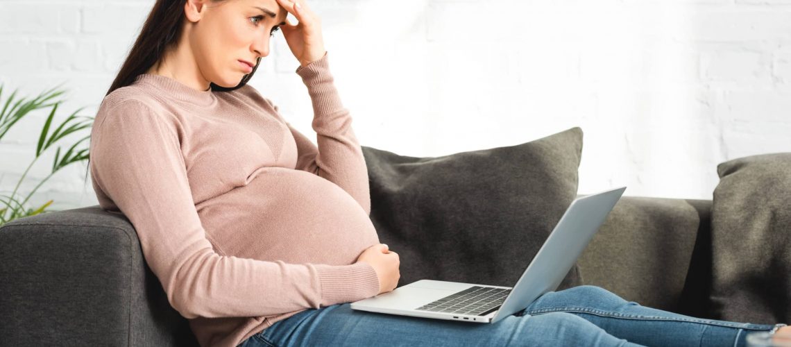Pregnant woman under stress from employer.