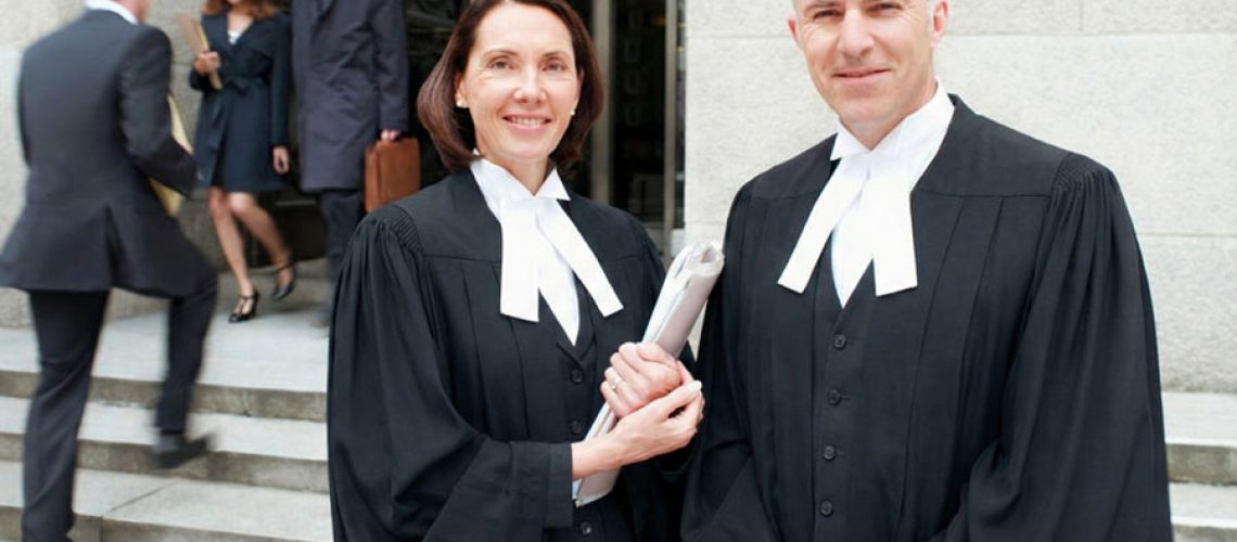 male female lawyers in gowns outside alberta courtroom